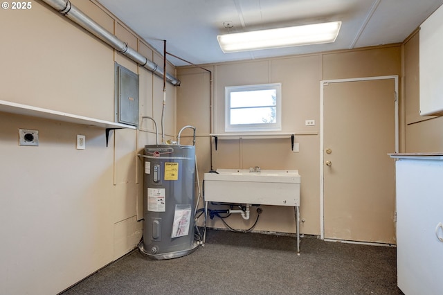 utilities with electric panel, water heater, and sink