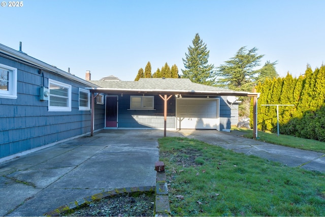 view of front of house with a front yard and a garage