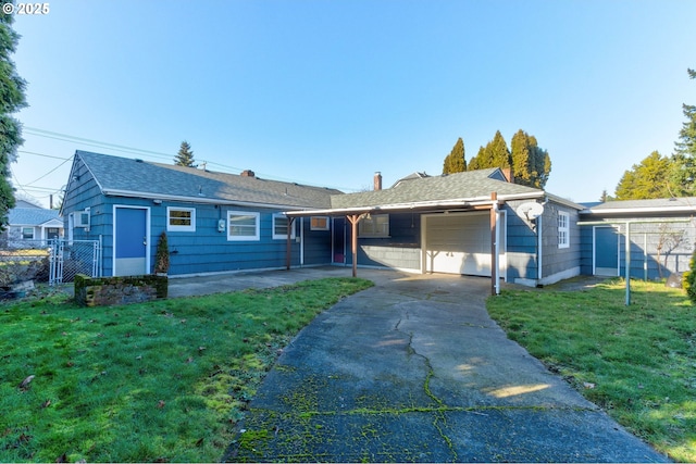 single story home with a carport, a garage, and a front yard