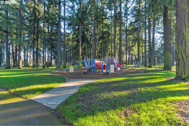 view of community featuring a yard and a playground