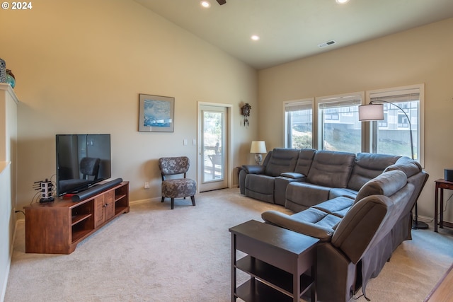 carpeted living area featuring recessed lighting, visible vents, baseboards, and high vaulted ceiling