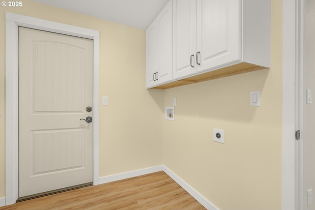 clothes washing area with baseboards, light wood-style flooring, hookup for a washing machine, cabinet space, and hookup for an electric dryer