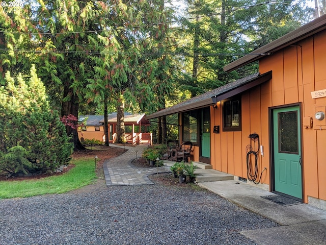 view of exterior entry featuring a patio