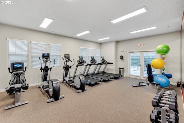 gym featuring a textured ceiling