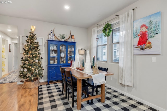 dining room with hardwood / wood-style floors