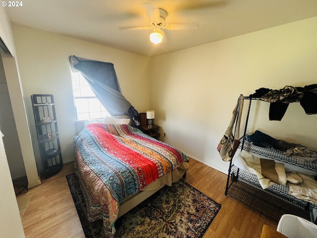 bedroom featuring hardwood / wood-style floors and ceiling fan