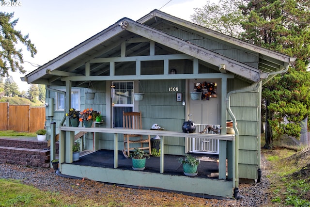 view of outbuilding featuring covered porch