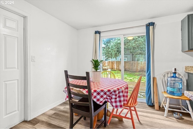 dining area with light hardwood / wood-style flooring