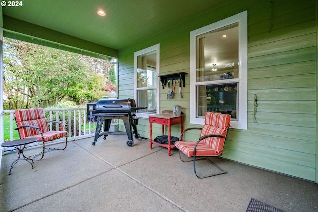 view of patio with a grill and a porch