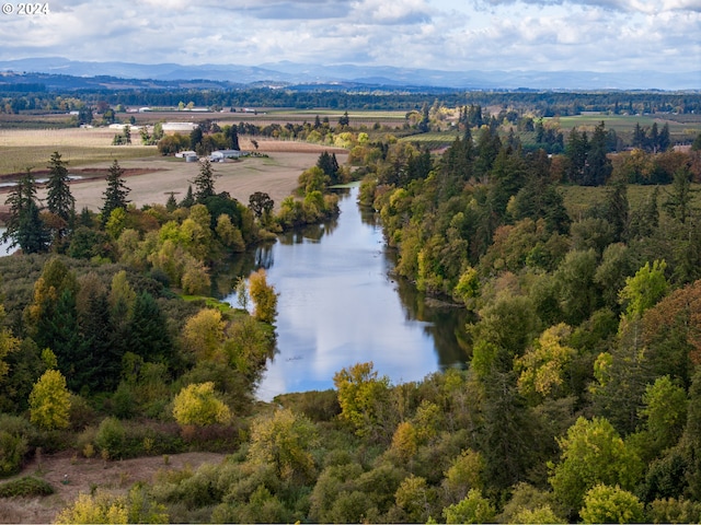 bird's eye view with a water and mountain view