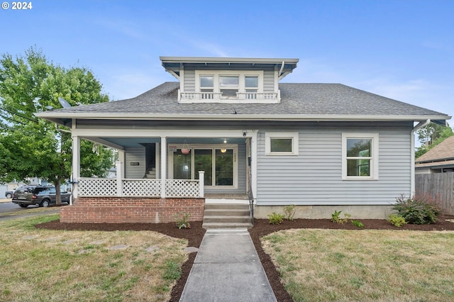 view of front of home featuring a porch and a front yard