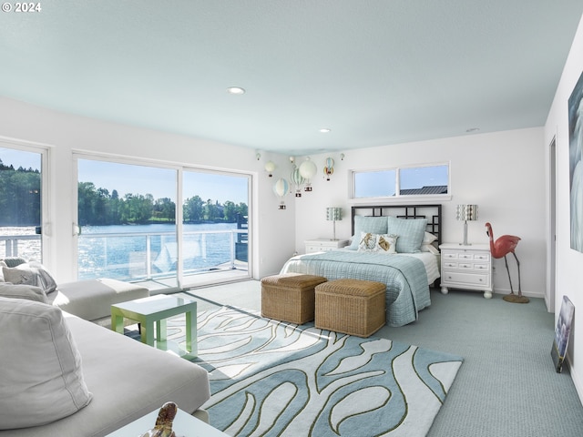 bedroom with access to outside, carpet floors, and a water view