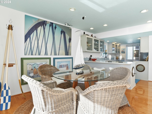 dining space featuring light hardwood / wood-style floors