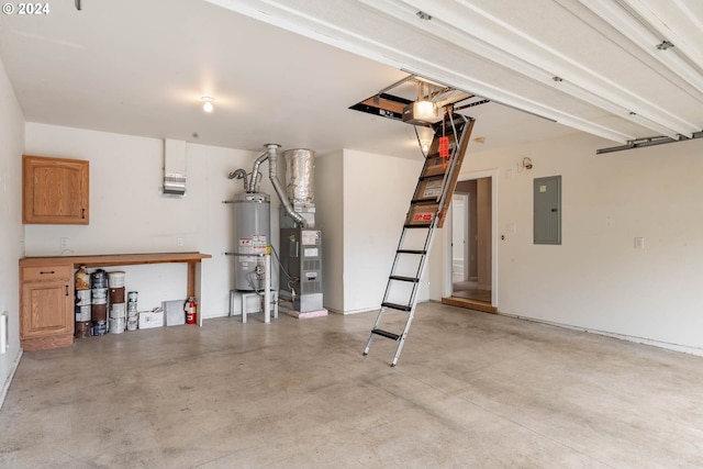 garage featuring water heater, electric panel, and heating unit