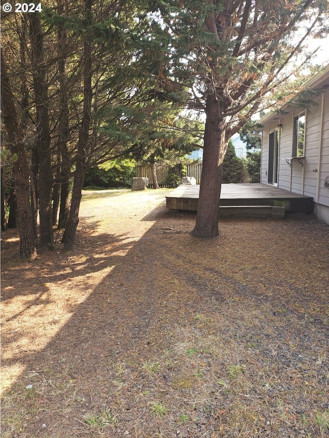 view of yard with a wooden deck