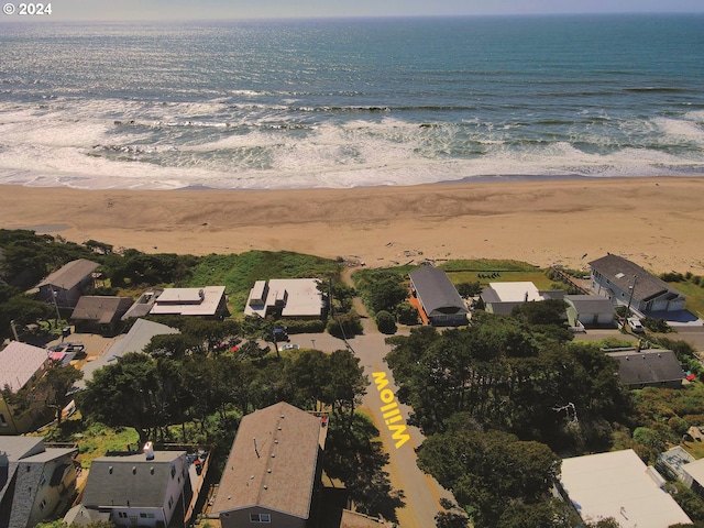 bird's eye view featuring a beach view and a water view