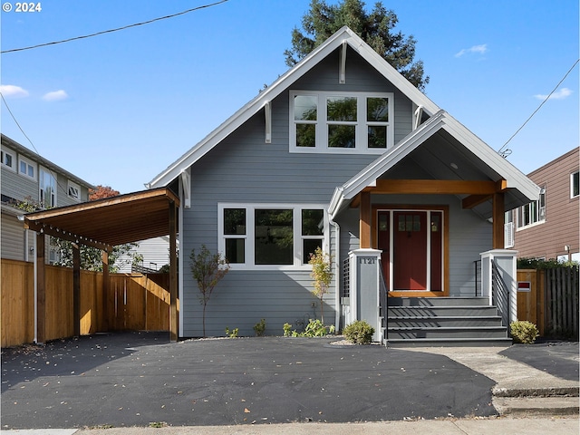 view of front of home featuring a carport