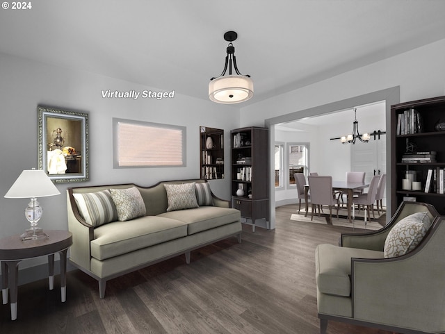 living room featuring a notable chandelier and wood-type flooring