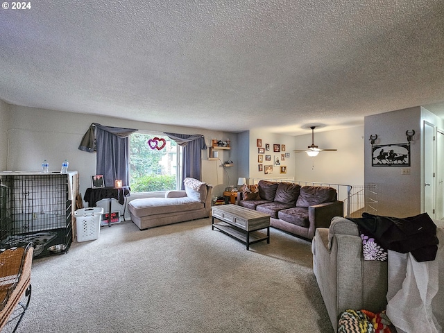 carpeted living room with a textured ceiling and ceiling fan