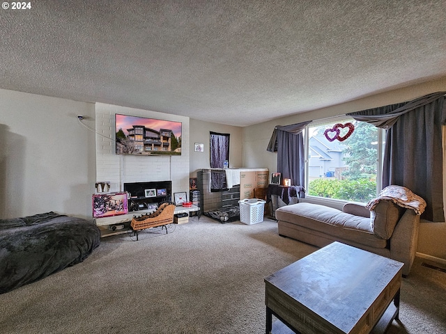 carpeted living room with brick wall and a textured ceiling