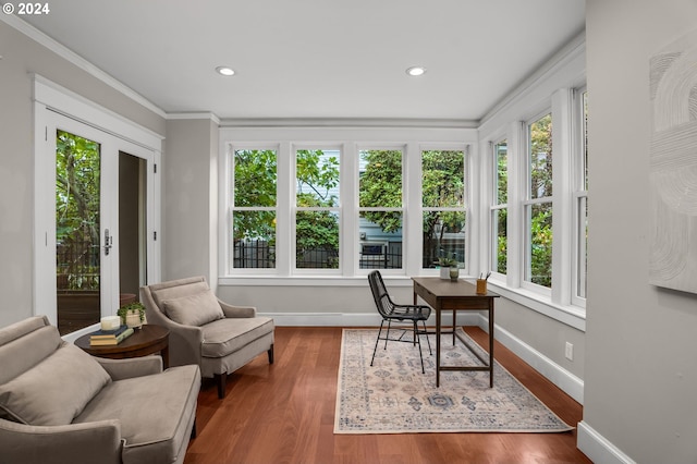 office area with wood-type flooring and ornamental molding