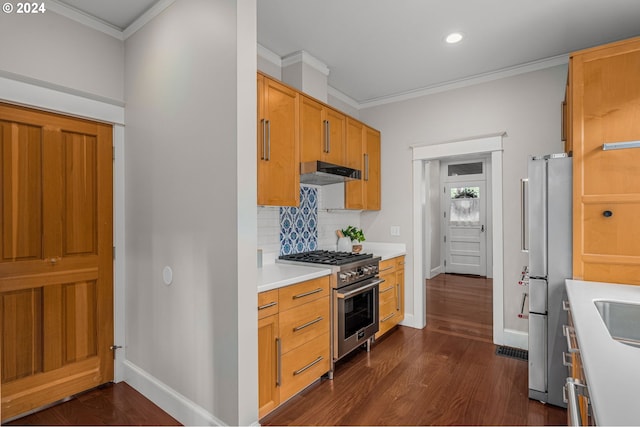 kitchen with crown molding, stainless steel appliances, backsplash, and dark hardwood / wood-style flooring