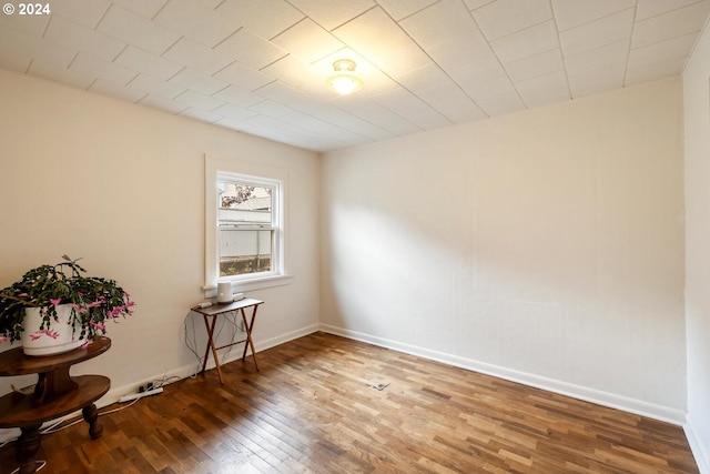 spare room with wood-type flooring