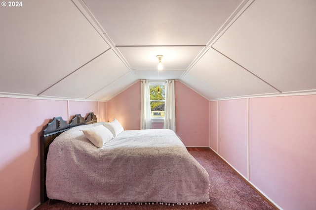 bedroom with carpet flooring and lofted ceiling