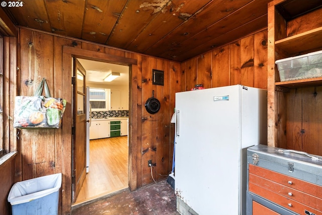 interior space featuring wooden ceiling and wood walls