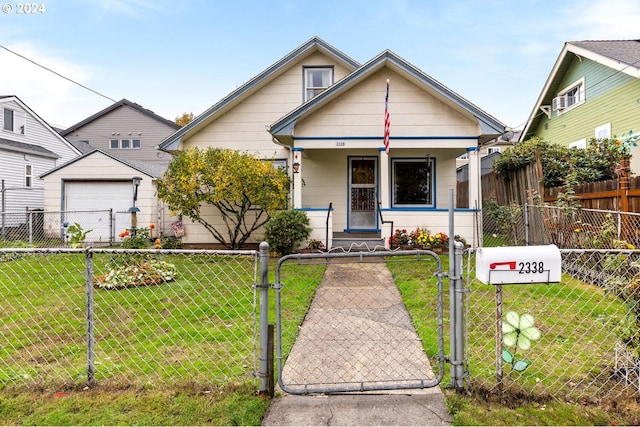 bungalow-style house featuring covered porch, a front yard, and a garage