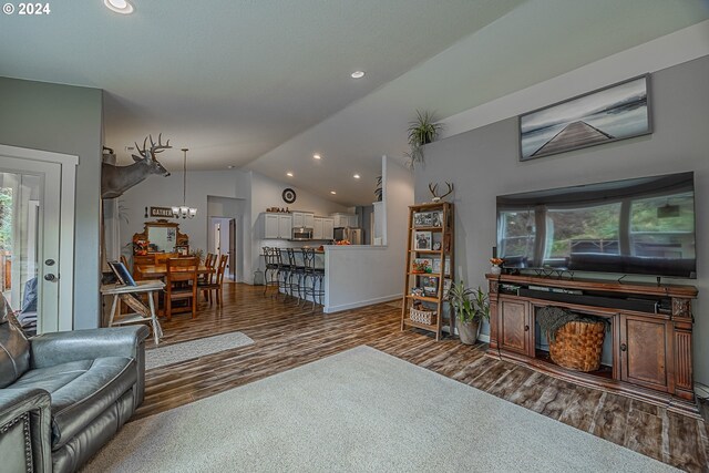 1843 Shelley Rd, Coquille, OR 97423 - living area with lofted ceiling, wood finished floors, recessed lighting, a chandelier, and baseboards