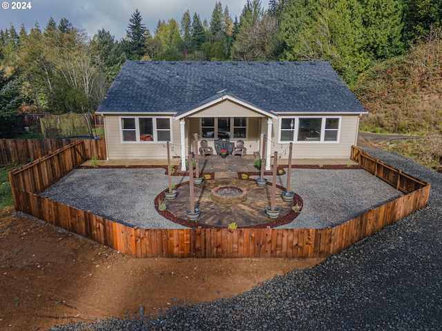 view of front facade featuring a patio area and an outdoor fire pit