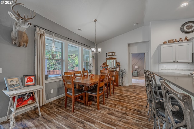 1843 Shelley Rd, Coquille, OR 97423 - dining room featuring vaulted ceiling, baseboards, dark wood finished floors, and a chandelier