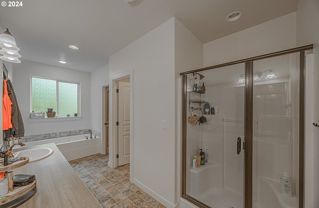 1843 Shelley Rd, Coquille, OR 97423 - bathroom featuring a sink, a shower stall, a bath, recessed lighting, and baseboards