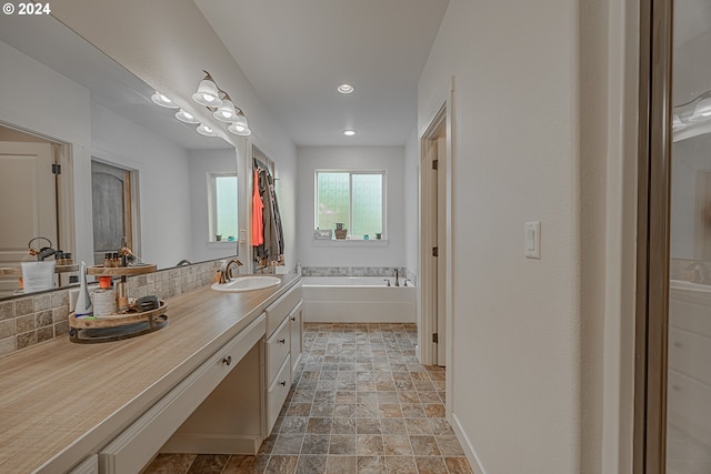 1843 Shelley Rd, Coquille, OR 97423 - bathroom with vanity, a bath, stone finish floors, and recessed lighting