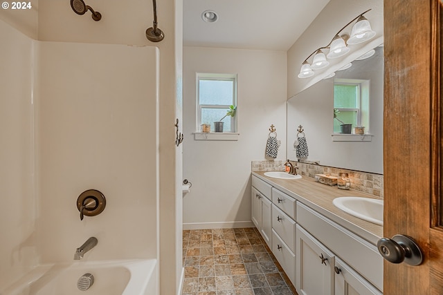 1843 Shelley Rd, Coquille, OR 97423 - bathroom with double vanity, baseboards, shower / washtub combination, and stone finish floors