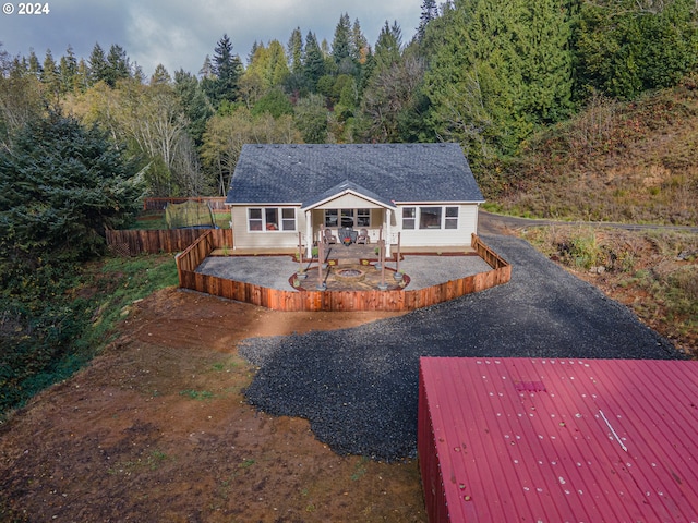 1843 Shelley Rd, Coquille, OR 97423 - back of property with a forest view, a wooden deck, and driveway