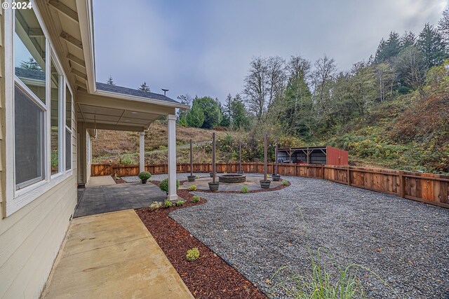 1843 Shelley Rd, Coquille, OR 97423 - fenced backyard featuring a fire pit and a patio area
