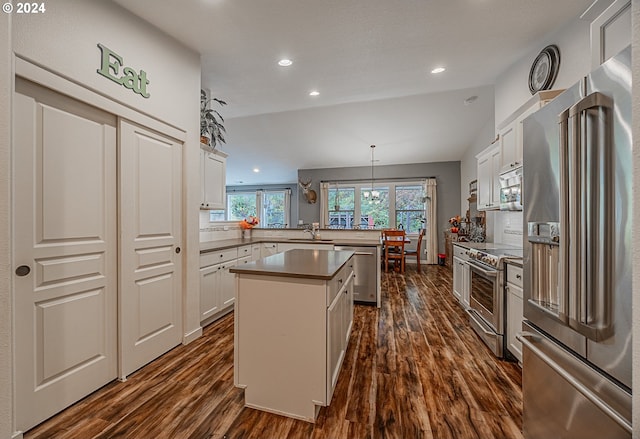 1843 Shelley Rd, Coquille, OR 97423 - kitchen with appliances with stainless steel finishes, a peninsula, dark wood-style floors, a sink, and recessed lighting