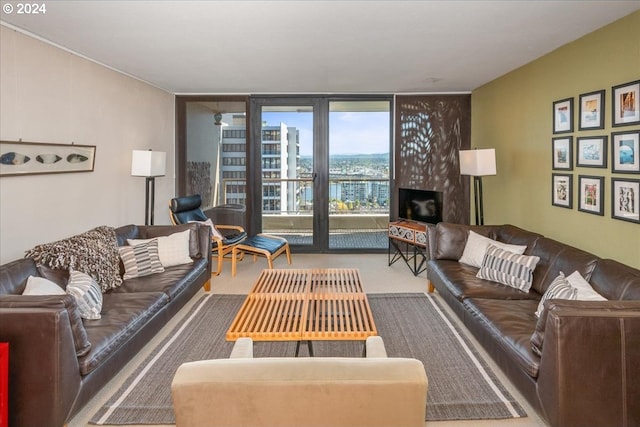 living room with carpet flooring and floor to ceiling windows