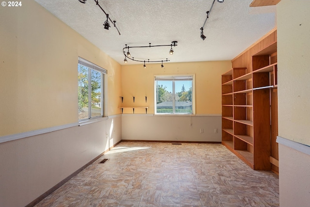 empty room with a textured ceiling