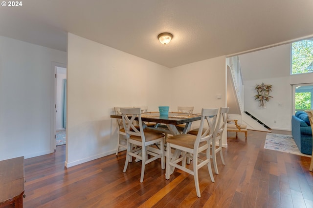 dining space with dark wood-type flooring