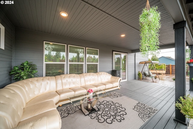 wooden terrace with an outdoor hangout area