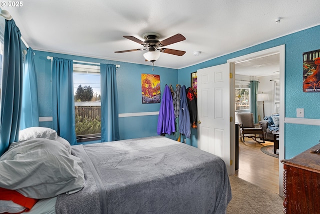 bedroom featuring ceiling fan and wood-type flooring