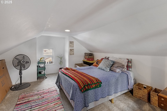 bedroom with carpet flooring and vaulted ceiling