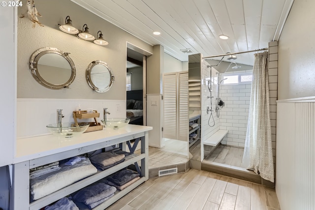 bathroom with sink, hardwood / wood-style floors, wood ceiling, and a shower with curtain