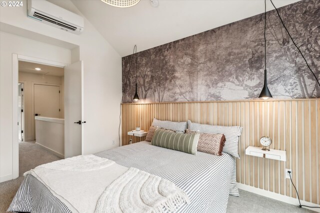 carpeted bedroom featuring lofted ceiling and a wall mounted AC