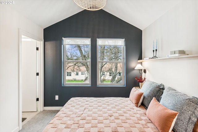 carpeted bedroom with vaulted ceiling