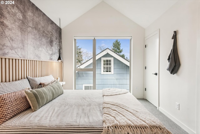 bedroom with lofted ceiling and carpet floors