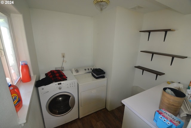 washroom with dark hardwood / wood-style flooring and washer and clothes dryer